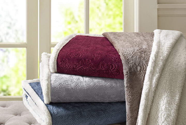 This super soft plush throw features a textured design that adds dimension to the throw. The reverse features a cozy berber to keep you warm. It's also oversized for added warmth and comfort.