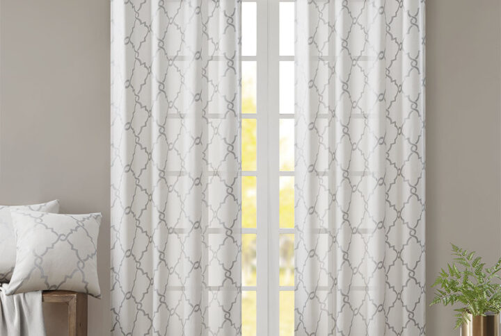 The Madison Park Saratoga Fret Print Panel is the perfect addition for a casual and stylish update to your home decor. This window panel features a trendy metallic silver fretwork on a soft ivory ground