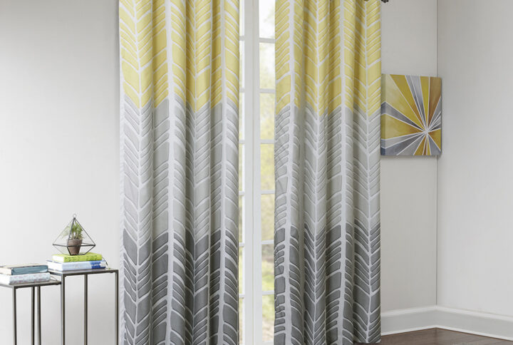 Create a color blocked look in your room with our Intelligent Design Adel Total Blackout Window panel. This geometric chevron design uses light grey