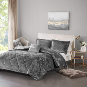 Create a lush and relaxing atmosphere in your bedroom with the Intelligent Design Felicia Velvet Comforter Set. The grey comforter is made from crushed velvet and features diamond quilting for a luxurious look. Matching crushed velvet sham(s) and an oblong decorative pillow complement the comforter to complete the modern style bedding set. Machine washable for easy care