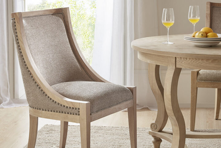 Update your dining room decor with The Martha Stewart Elmcrest Dining Chair.  Featuring a natural solid wood frame with clean lines