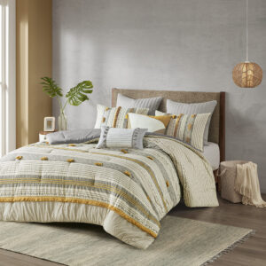 The INK+IVY Cody 3 Piece Cotton Comforter Set brings a smart combination of texture and style to your bedroom. This 100% cotton comforter features a grey and yellow striped print with pompom and trim details for a casual