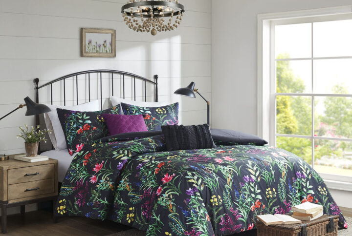 The Madison Park Tasha 5 Piece Comforter Set offers a striking floral update to your bedroom decor. This softspun comforter features a beautiful botanical print that creates a stunning contrast with the black base fabric