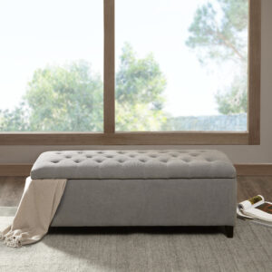 The Madison Park Shandra Tufted Top Storage Bench offers a sophisticated storage option that elevates your home decor. This accent bench come fully upholstered and features a button tufted top that adds a refined touch to the luxurious design. The solid wood legs showcase a dark wood finish that beautifully complements the upholstery