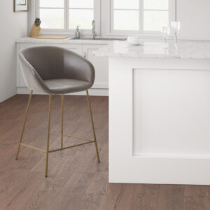 Elevate the look of your kitchen or dining room with the Madison Park Isadora Counter Stool. The low seat and back are upholstered in brown polyurethane leather and the slender metal base flaunts a gold finish