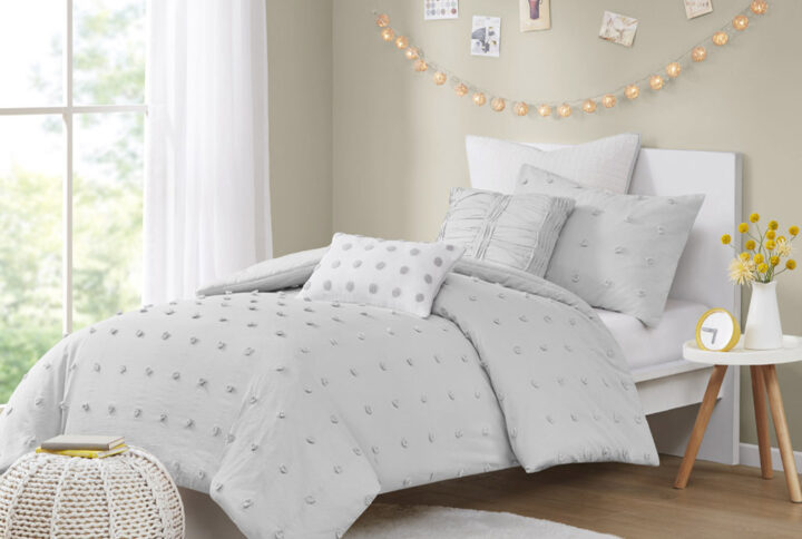 The Urban Habitat Brooklyn Cotton Jacquard Duvet Cover Set features small tufted chenille dots that create a fresh shabby chic look. This duvet cover set brings a soft and charming update to your bedroom