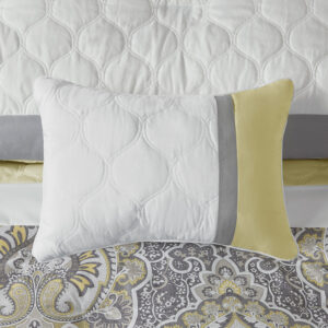 this ultra-soft microfiber comforter flaunts a partial damask print in yellow