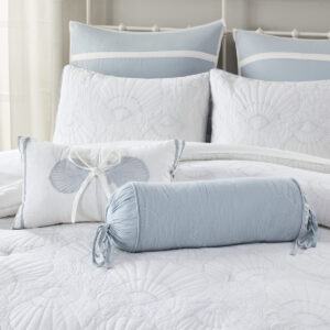 Complete your bedroom with the Harbor House Crystal Beach Quilted Bolster Pillow. This blue cotton bolster pillow features all-over quilting in a seashell motif with ties at each end