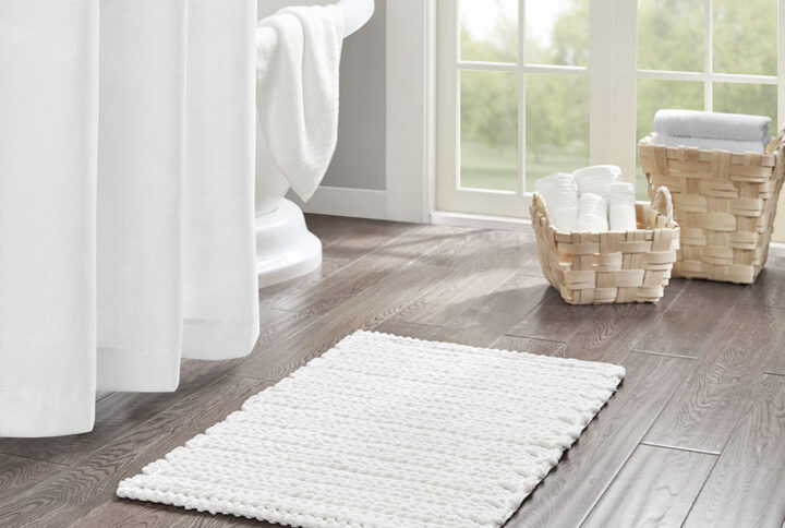 The Madison Park Lasso 100% Cotton Chenille Chain Stitch Rug provides a soft textural update to your bathroom decor. This cotton chenille bath rug features a woven chain stitch design that creates dimension and texture