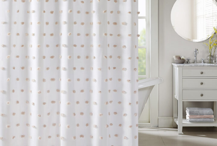 Add a fun update to your space with the Madison Park Sophie shower curtain. The solid white background features rows of soft blush fabric pom poms