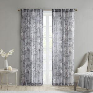 The Madison Park Simone Printed Floral Rod Pocket and Back Tab Top Voile Sheer brings a soft and romantic touch to your home decor. This voile sheer curtain panel features a beautiful mauve and neutral printed floral on a dark grey ground for a rich and stylish contrast