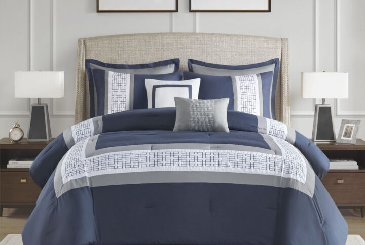 510 Design presents the Powell 8 Piece Embroidered Comforter Set to elevate your bedroom decor. This hotel style navy comforter features an embroidered and pieced border for a sophisticated and elegant design that easily coordinates with your space. The matching pillow shams also flaunt beautiful embroidery details