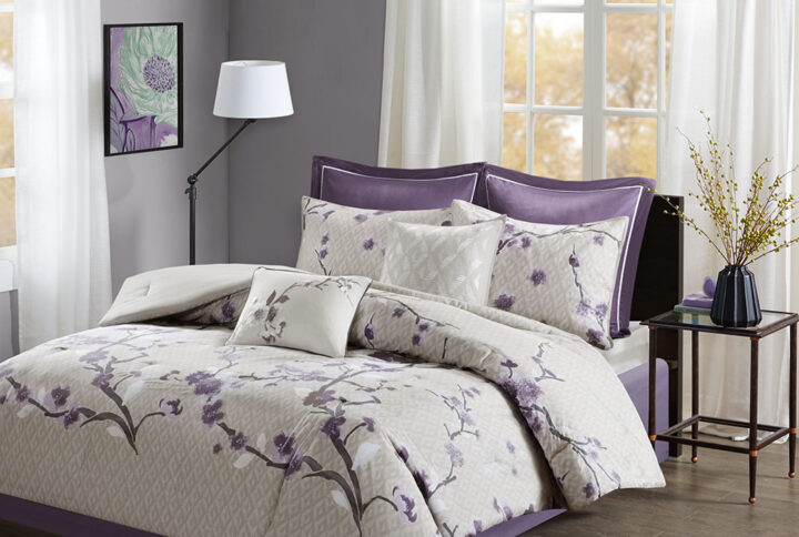 The Madison Park Holly 8 Piece Comforter Set will transform your bedroom décor with charm and elegance. The cotton sateen fabric has a greyish taupe diamond background with a lovely floral print in purple