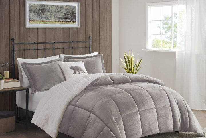 Bring the warmth and comfort of a cabin retreat to your bedroom with the Woolrich Alton Plush to Sherpa Down Alternative Comforter Set. Made from ultra-soft plush and reversing to a cozy berber