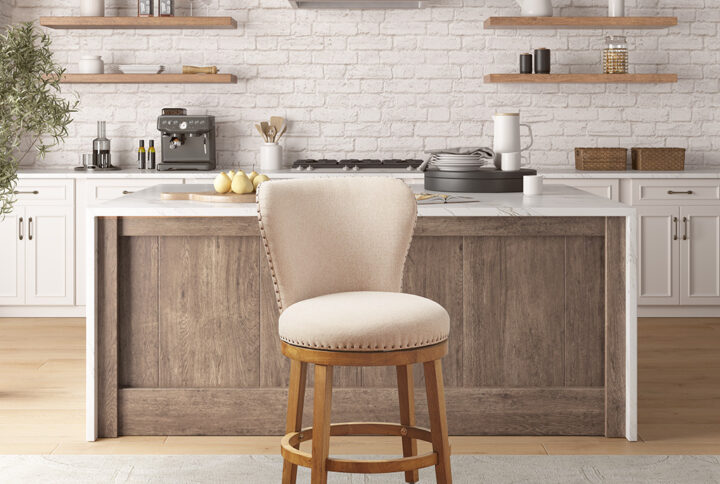 Comfort and style are beautifully combined in this Madison Park Stewart swivel counter stool. The generously sized round padded seat and curved back are upholstered in a tan fabric to provide an inviting place to sit at your kitchen counter. A bronze nailhead trim adds an elegant touch to the upholstery