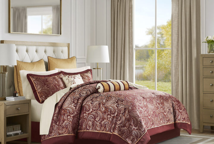 Give your bedroom a classic and elegant look with the Madison Park Aubrey 12 Piece Complete Bed Set including cotton bed sheets. This stunning set features a jacquard weave with a modern paisley pattern in a burnt red