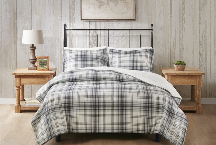 Wrap yourself in warmth and comfort with the Woolrich Bernston faux wool to faux fur down alternative comforter set. This set features a faux wool face with a printed plaid pattern