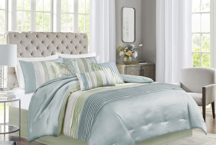 Amherst’s modern color blocked design is a simple way to add style to your room. This comforter is covered in larges stripes in shades of green and blue. Made from polyester jacquard and a brushed fabric reverse this comforter is soft to the touch and is machine washable for easy care. The comforter set includes two matching king shams and three decorative pillows that accent the color blocked look.