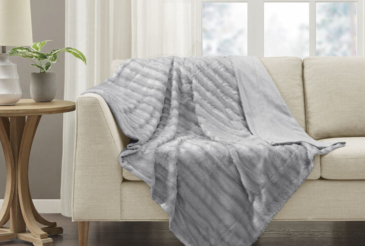 Wrap yourself in the lush comfort of the Madison Park Duke Long Fur Throw. The ultra-soft faux fur face provides comfort and coziness