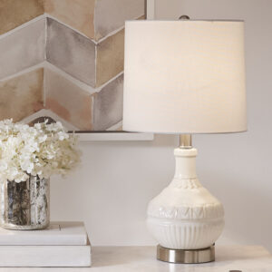 Update your space with the sleek style of the Gypsy Embossed Boho Table Lamp. The base is made from ceramic with a painted white finish for a sleek gradient look. The white