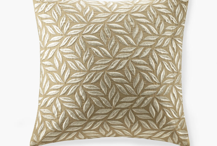 This Melodia pillow features continuous leaf all-over embroidery on natural cotton-linen. It's a chic and glamorous look that can pair well with both elegant and luxury bedding sets. It comes with a soft and plump removable white goose feather insert.