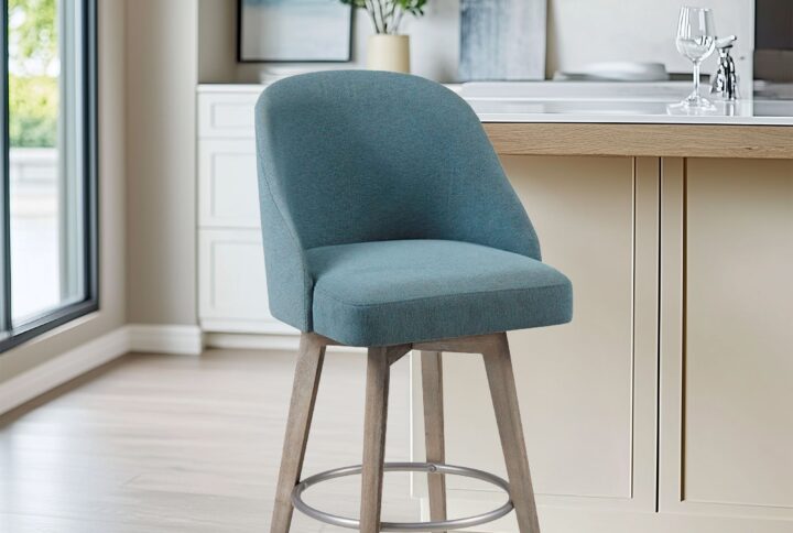 Elevate your kitchen or dining space with the Madison Park Pearce Swivel Counter Stool