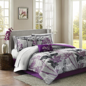 Make a bold fashion statement in your bedroom with the Madison Park Essentials Claremont Comforter Set with Cotton Sheet Set. A large scale bright purple and black floral print covers the grey comforter