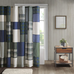 Create a cozy cabin look in your bathroom with the Woolrich Mill Creek shower curtain. This 100% cotton shower curtain features a pieced plaid patchwork design in green