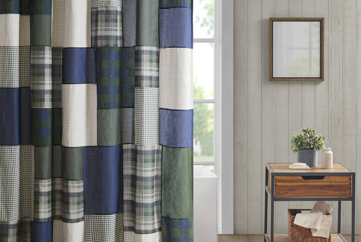 Create a cozy cabin look in your bathroom with the Woolrich Mill Creek shower curtain. This 100% cotton shower curtain features a pieced plaid patchwork design in green