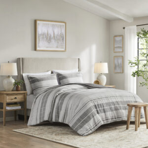 This modern farmhouse bedding set features printed black stripes on a grey and white background made of a cotton/poly slub fabric for a linen-like look. The cotton/poly blend offers softness