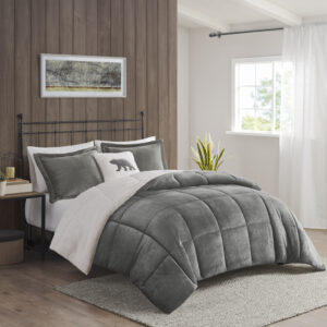 Bring the warmth and comfort of a cabin retreat to your bedroom with the Woolrich Alton Plush to Sherpa Down Alternative Comforter Set. Made from ultra-soft plush and reversing to a cozy berber