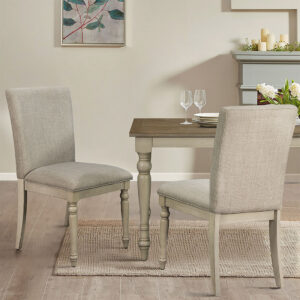 The Martha Stewart Fiona Dining Chair Set with Turned Wood Legs offers a classic farmhouse update to your dining room decor. This dining chair features an upholstered back and seat with a whitewashed solid wood frame to create a warm and welcoming allure. The solid wood legs flaunt turned and distressed details to add a rustic elegance to the design. With its simple and refined look