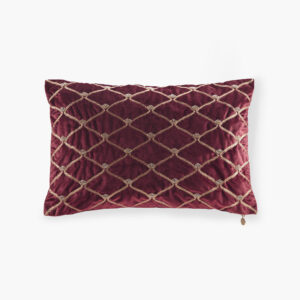 This sumptuous oblong pillow features foxtail stitched