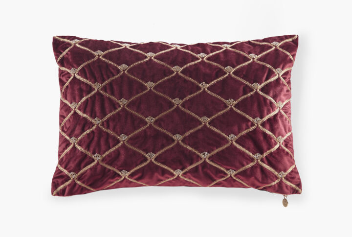 This sumptuous oblong pillow features foxtail stitched