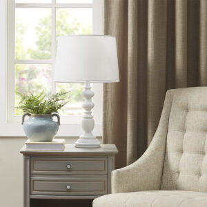 The Martha Stewart Astoria Resin Buffet Table Lamp offers a chic traditional update to your living room or bedroom. This table lamp features a resin frame in a matte white finish with a candle stick design to create a refined farmhouse look. The tapered lamp shade is made from linen to softly filter the light into your space and is not adjustable. This farmhouse table lamp also uses a rotary switch to find the right light setting and adds a subtle charm to your home decor. 1 Type-a light bulb is needed. Spot clean only. Comes with a 2-year warranty.