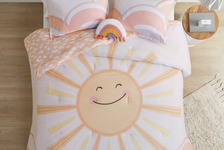 Brighten up your child’s bedroom with the Urban Habitat Kids Dawn Sunshine Printed Reversible Comforter Set. This soft yellow and coral cotton comforter features a large smiling sun print with a small scale cloud print on the reverse