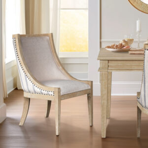 Introducing the epitome of farmhouse elegance—the dining chair from the exclusive Martha Stewart Lily Pond Collection. Showcasing a charming curved back profile