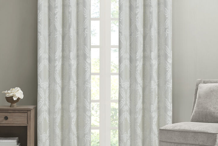 Our SunSmart Amelia Knitted Jacquard Paisley Total Blackout Grommet Top Curtain Panel adds the perfect touch of traditional elegance to your home. This total blackout white curtain features an intricate paisley design on a heavy textured jacquard fabric