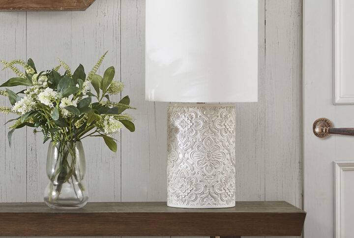 Elevate your decor with the elegance of the INK+IVY Ashbourne Embossed Floral Resin Table Lamp. Flaunting a beautifully intricate embossed floral design