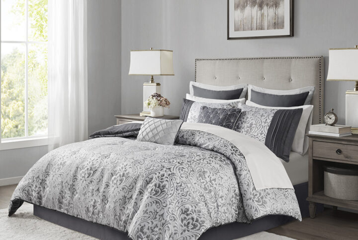 Give your bedroom a touch of elegance with this jacquard comforter set featuring a stunning damask pattern that shimmers due to the metallic threads. This bed in a bag comes with one comforter