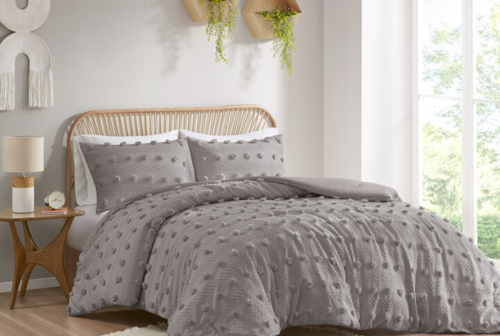 Refresh your bedroom with the elegant style of Intelligent Design's Lucy Clip Jacquard Comforter Set. This beautiful comforter features fun and playful clip jacquard pompoms all over the face that add dimension to the top of the bed for a lovely look. The matching shams (1 in Twin/TwinXL) also flaunt the delicate design of the comforter to complete the jacquard bedding set. Hypoallergenic polyester filling in the fashionable comforter contains no allergens and is treated to be dustproof. Machine washable for easy care