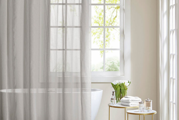 Add a casual update to your bathroom with the Anna sheer shower curtain. A striped texture within this shower curtain provides the perfect backdrop for the soft grey adding dimension to your space. As this curtain is sheer