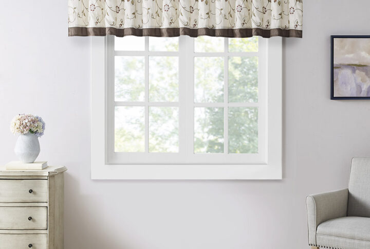 Add simple elegance to any room with the Madison Park Serene Embroidered Valance. This valance features delicate floral embroidery in rust spice and neutral hues