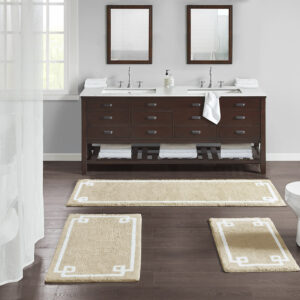 The Madison Park Evan Cotton Tufted Bath Rug provides the perfect balance of comfort and style to update your bathroom. This tufted bath rug features a contrasting white border on a soft colored ground creating a clean hotel look