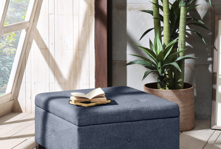 The Madison Park Della Ottoman offers a versatile storage option that’s full of style for your home. This square storage ottoman is upholstered in a blue fabric and features button-tufted details on the top and sides that add an elegant touch. Solid wood legs with a dark brown finish complement the upholstery. Providing ample storage space for your blankets and other essentials