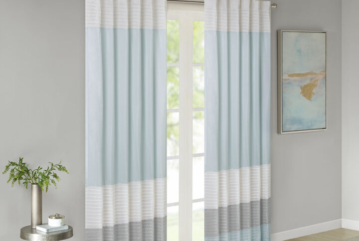 Amherst's modern color block design is a simple way to add style to your room. This window panel features color block stripes in soft hues of aqua