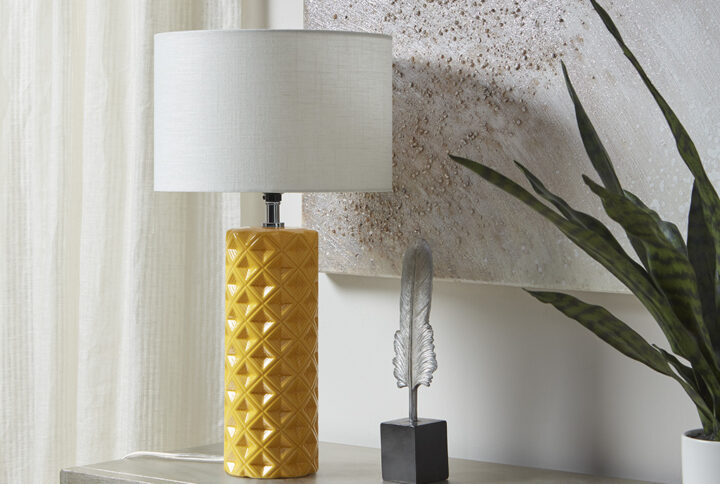 Make a statement in your living room with the eye-catching style of the 510 Design Macey Geometric Ceramic Table Lamp. This round table lamp flaunts a patterned ceramic base that adds dimension and texture to the design