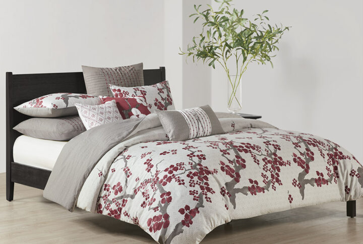 Create an oasis out of your space with the Natori Cherry Blossom Bedding Collection. This elegant duvet cover mini set features a 100% cotton sateen face with a diamond patterned ground and blooming cherry blossom branches inching up to the top and reverses to a 100% cotton percale heather grey tone of the same diamond pattern print for a dramatic feel. The set is machine washable for easy care and includes one oversized duvet cover and two shams. A button closure at the foot end secures a padded insert within the duvet cover and inside corner ties prevent it from shifting (insert is NOT included). Complete the look with the coodinating bedding accessories