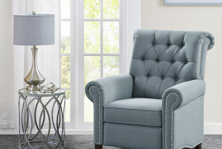 Update your living space with the elegant transitional style of the Madison Park Aidan Push Back Recliner. Rounded arms and a high rounded back give this recliner chair a simple