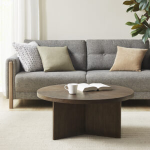 Give your living room a chic modern focal point with the Sadie Coffee Table by Martha Stewart. This round coffee table flaunts a rich walnut wood finish with a starburst pattern on the veneer top to create a stunning contemporary look. With its simple design